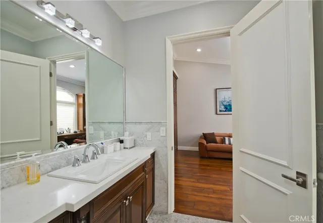 a open kitchen with stainless steel appliances granite countertop a stove and cabinets with wooden floor