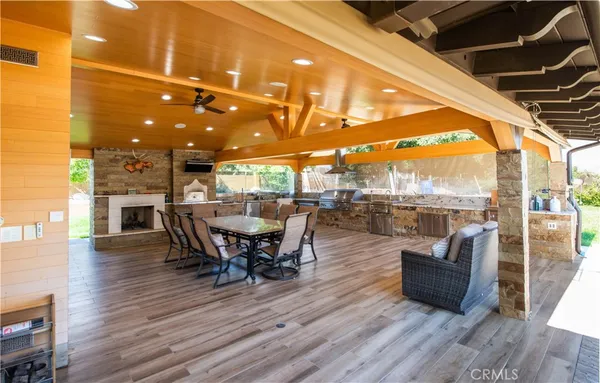 a view of a house with pool and a yard