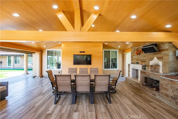 a view of a house with swimming pool and a yard