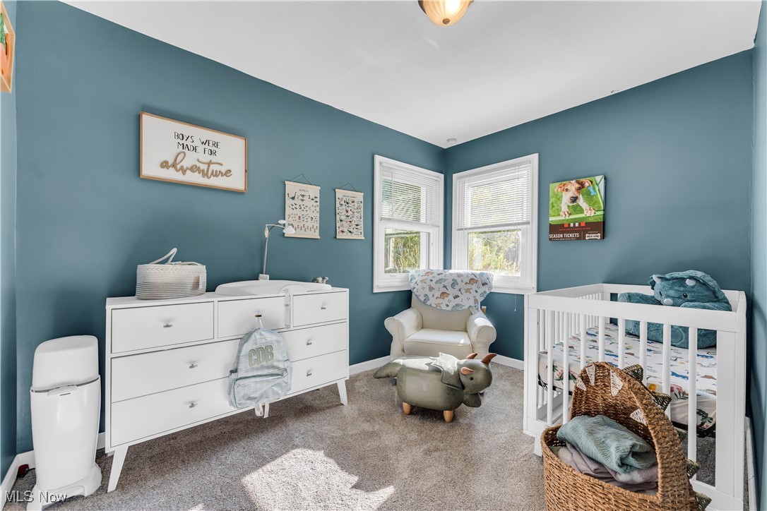 7479 Macedonia Road Bedford, OH 44146 - Photo 27 of 42 Carpeted bedroom featuring a nursery area