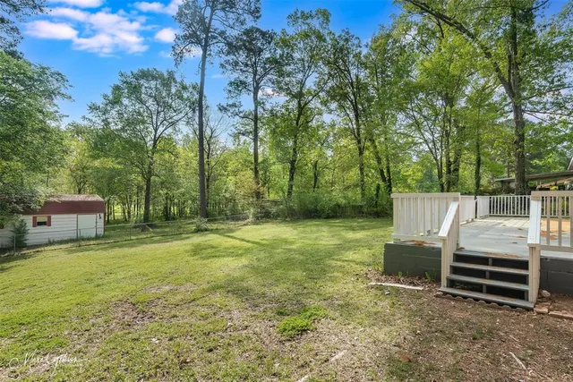 a view of a chairs and tables in the yard