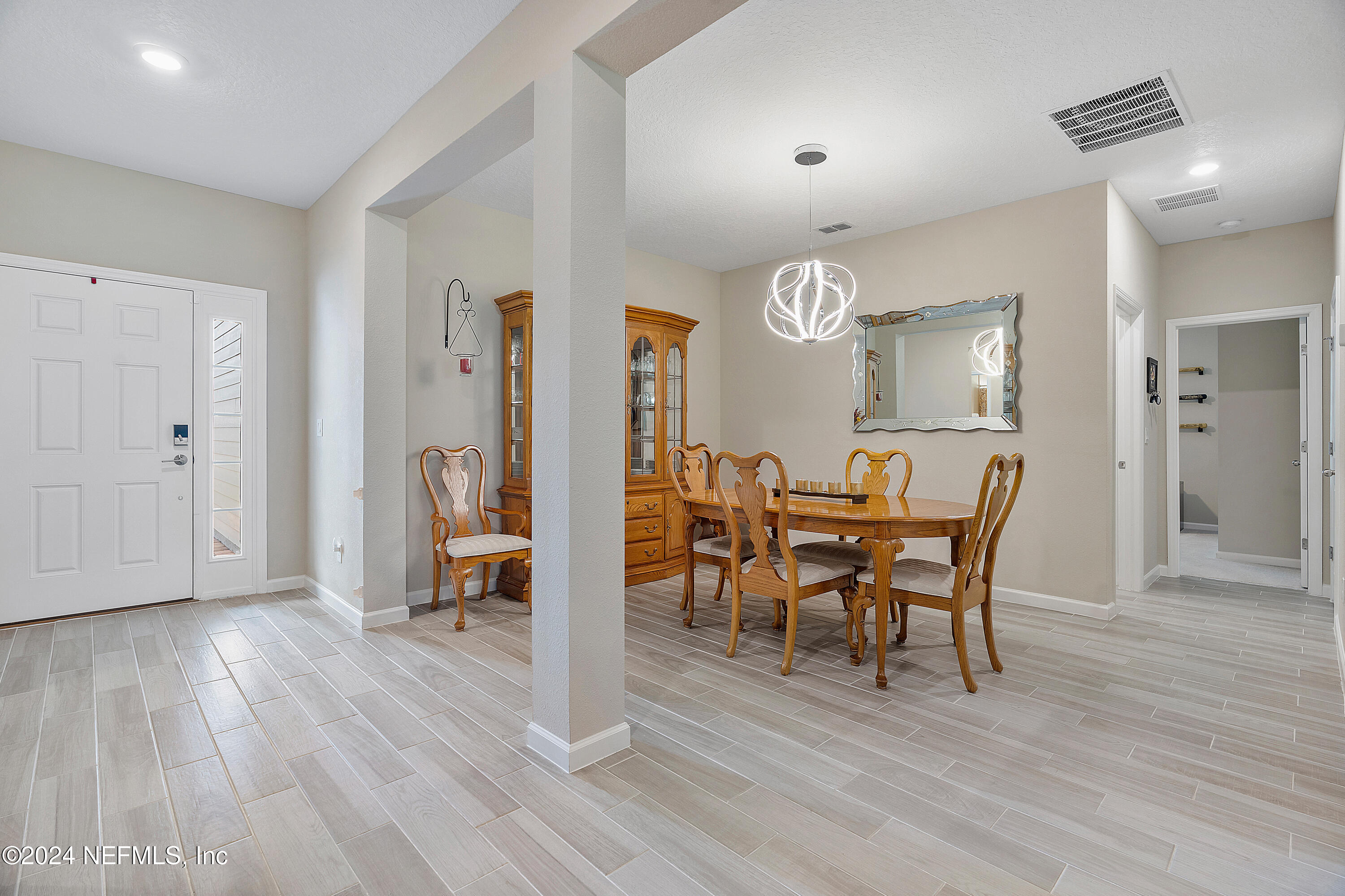 208 Gan Way St. Johns, FL 32259 - Photo 15 of 53 a view of a a dining room with furniture window and wooden floor