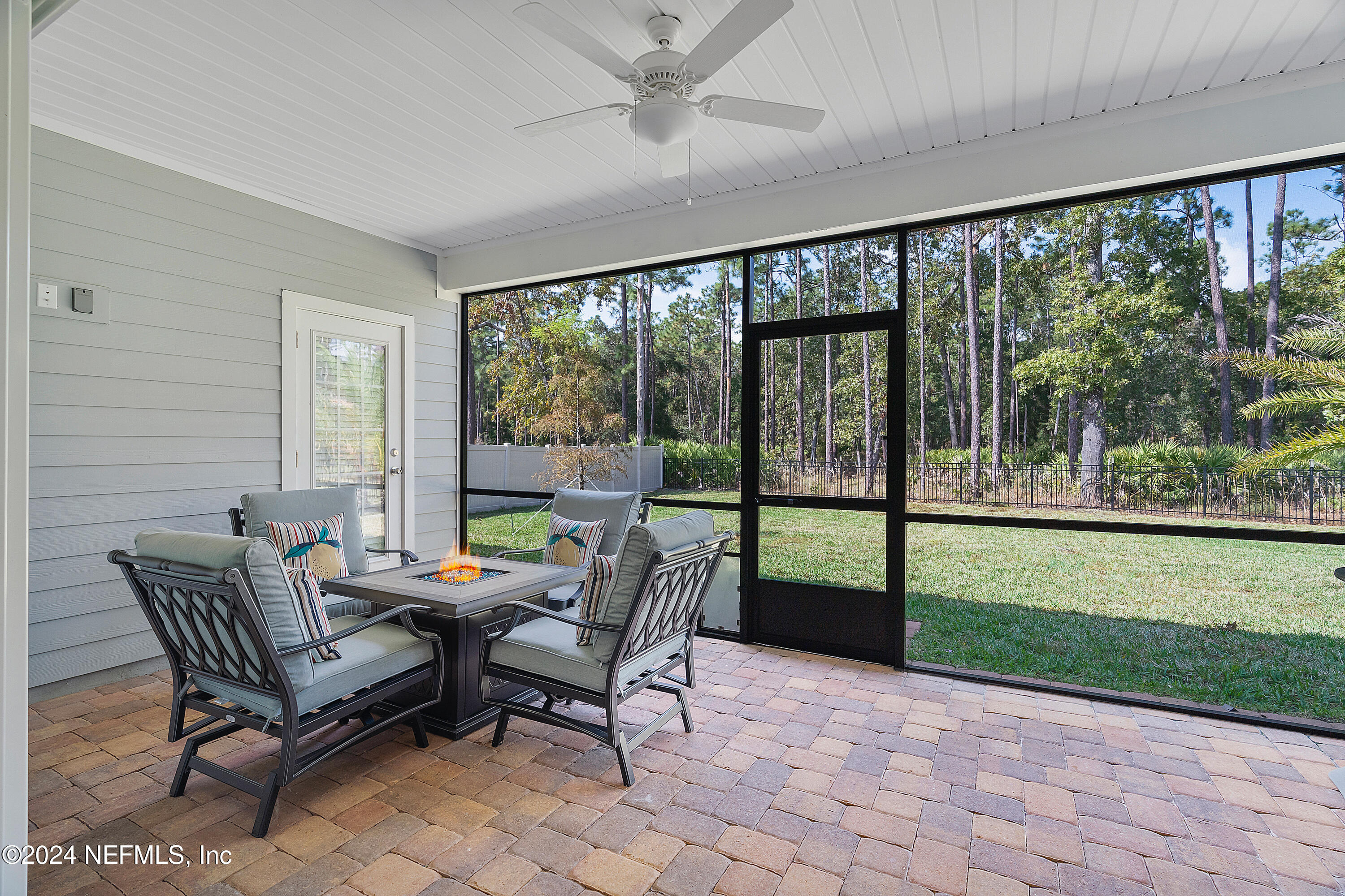 208 Gan Way St. Johns, FL 32259 - Photo 32 of 53 a outdoor room with chairs and a yard