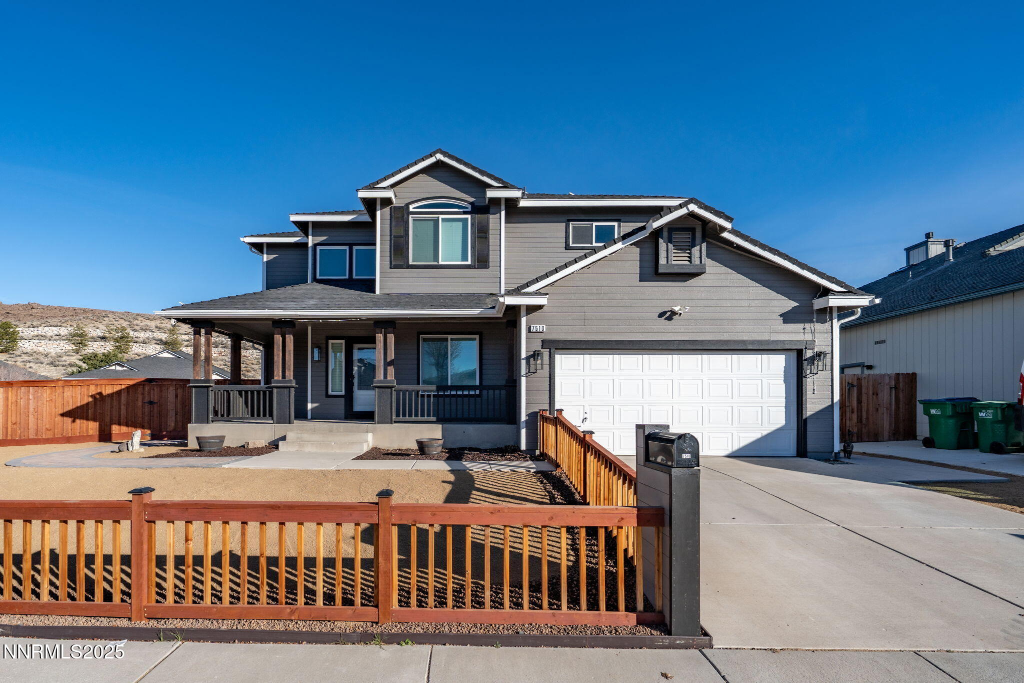 7510 Michaela Drive Reno, NV 89511 - Photo 1 of 33 a front view of a house with a porch