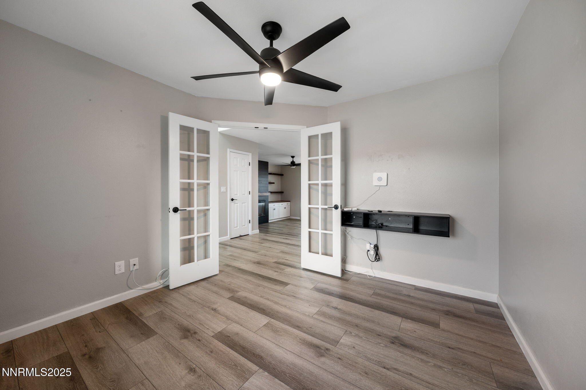 7510 Michaela Drive Reno, NV 89511 - Photo 11 of 33 a view of a hallway with wooden floor