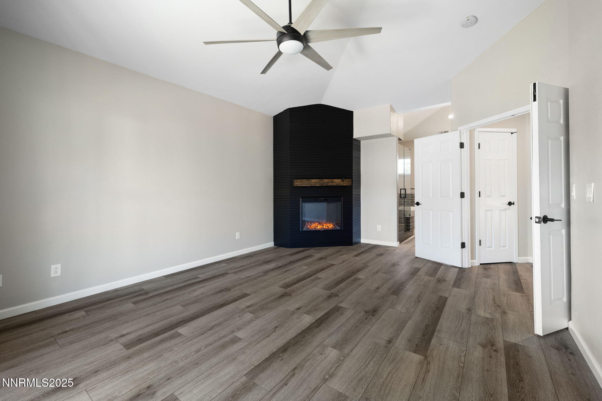 7510 Michaela Drive Reno, NV 89511 - Photo 15 of 33 a view of an empty room with a window and wooden floor