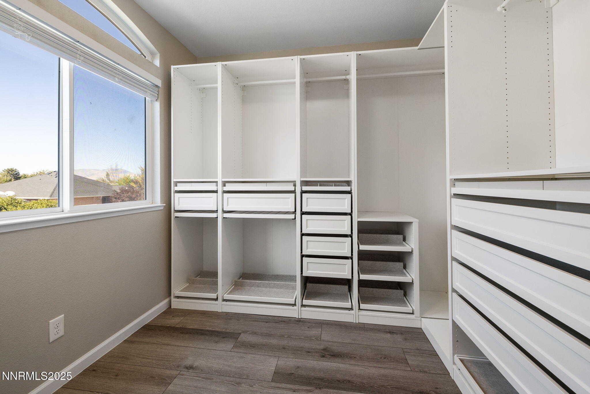 7510 Michaela Drive Reno, NV 89511 - Photo 19 of 33 a view of walk in closet with empty racks