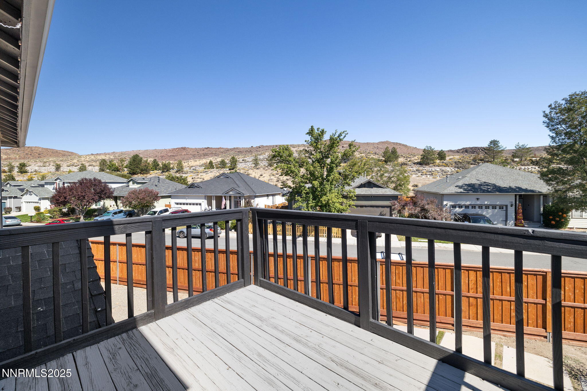 7510 Michaela Drive Reno, NV 89511 - Photo 20 of 33 a view of a balcony with wooden floor and city view