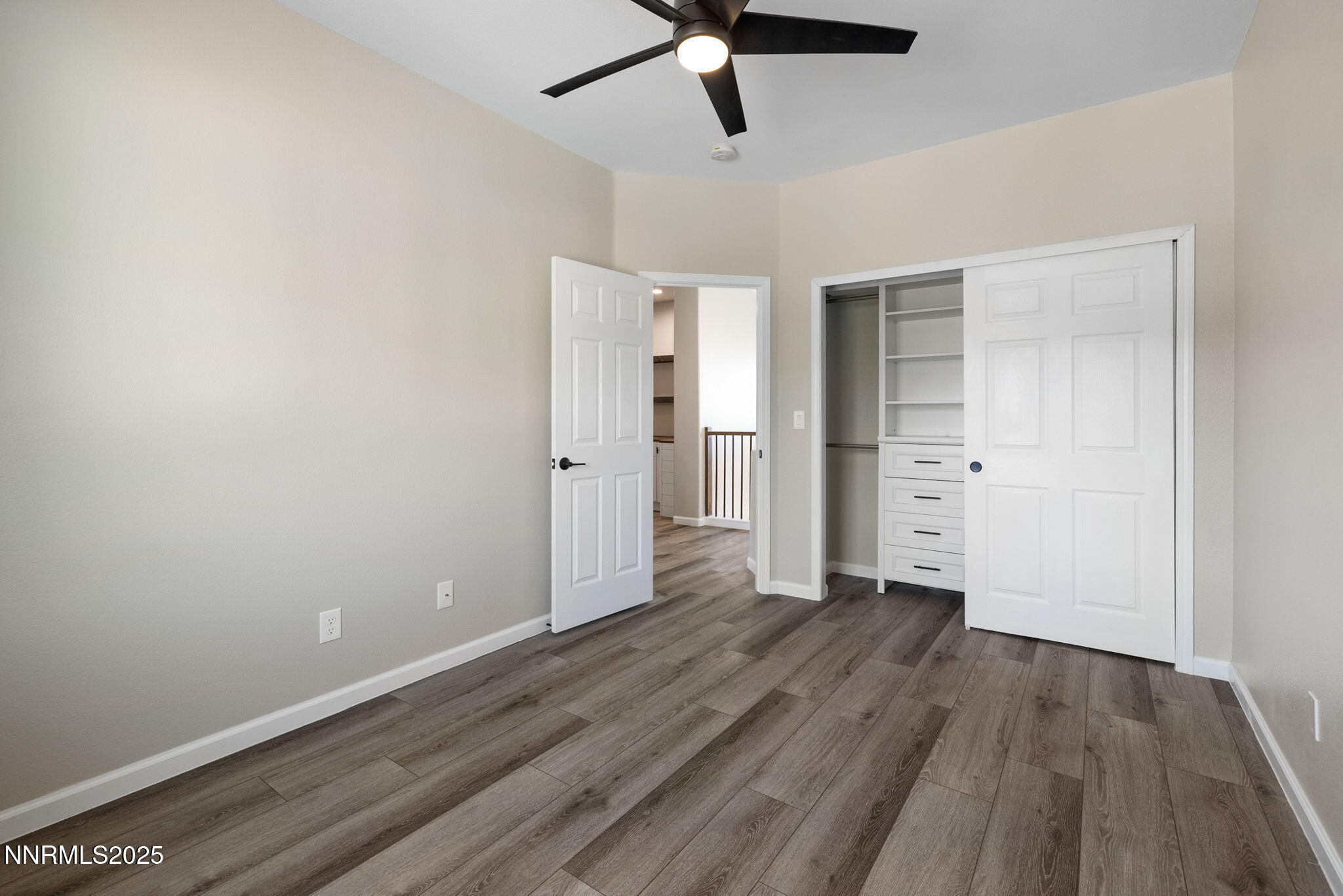 7510 Michaela Drive Reno, NV 89511 - Photo 24 of 33 a view of empty room with wooden floor