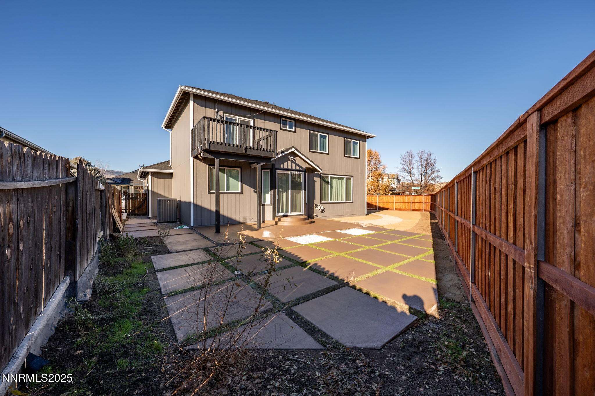 7510 Michaela Drive Reno, NV 89511 - Photo 28 of 33 a front view of a house with wooden fence