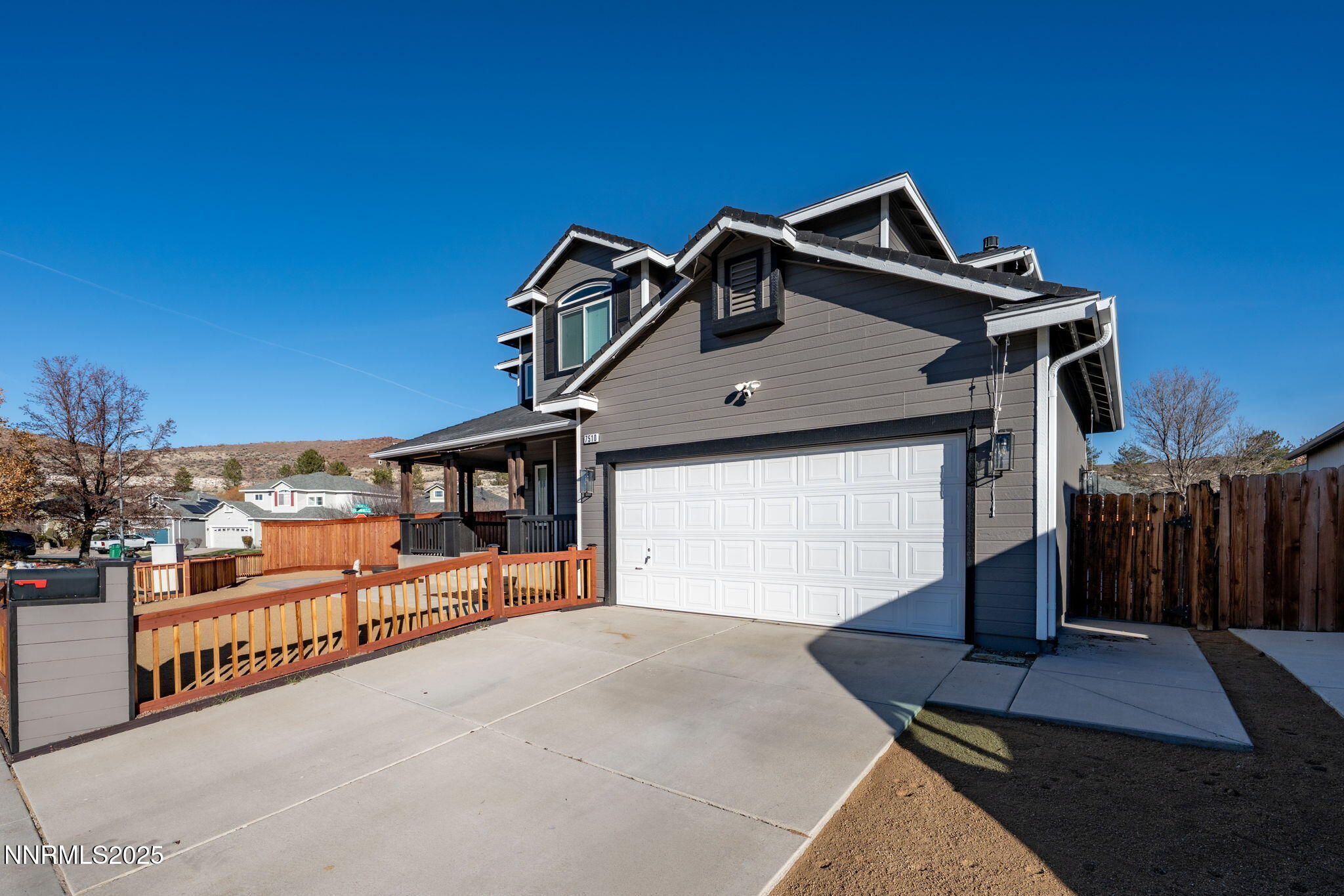 7510 Michaela Drive Reno, NV 89511 - Photo 30 of 33 a front view of a house with a garage