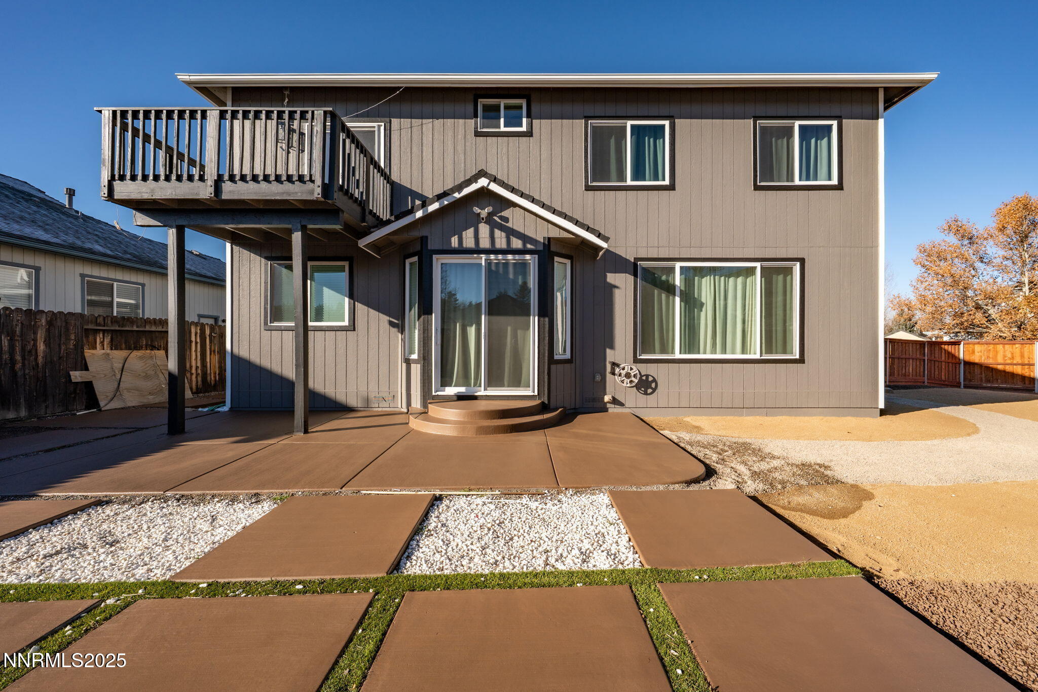 7510 Michaela Drive Reno, NV 89511 - Photo 3 of 33 a front view of a house with a yard