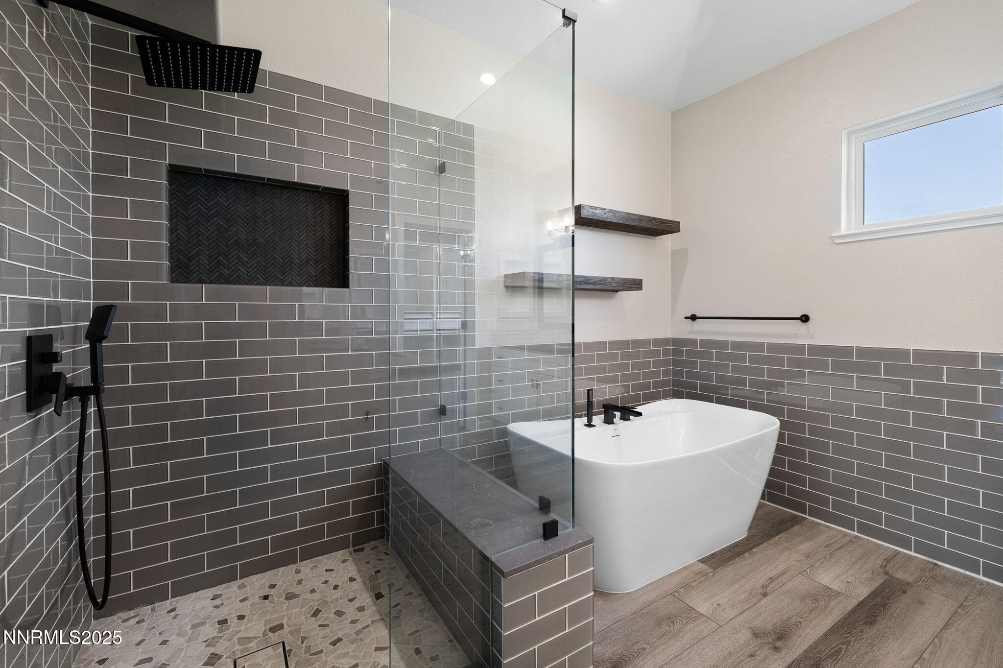 7510 Michaela Drive Reno, NV 89511 - Photo 4 of 33 a bathroom with a sink a bathtub and shower