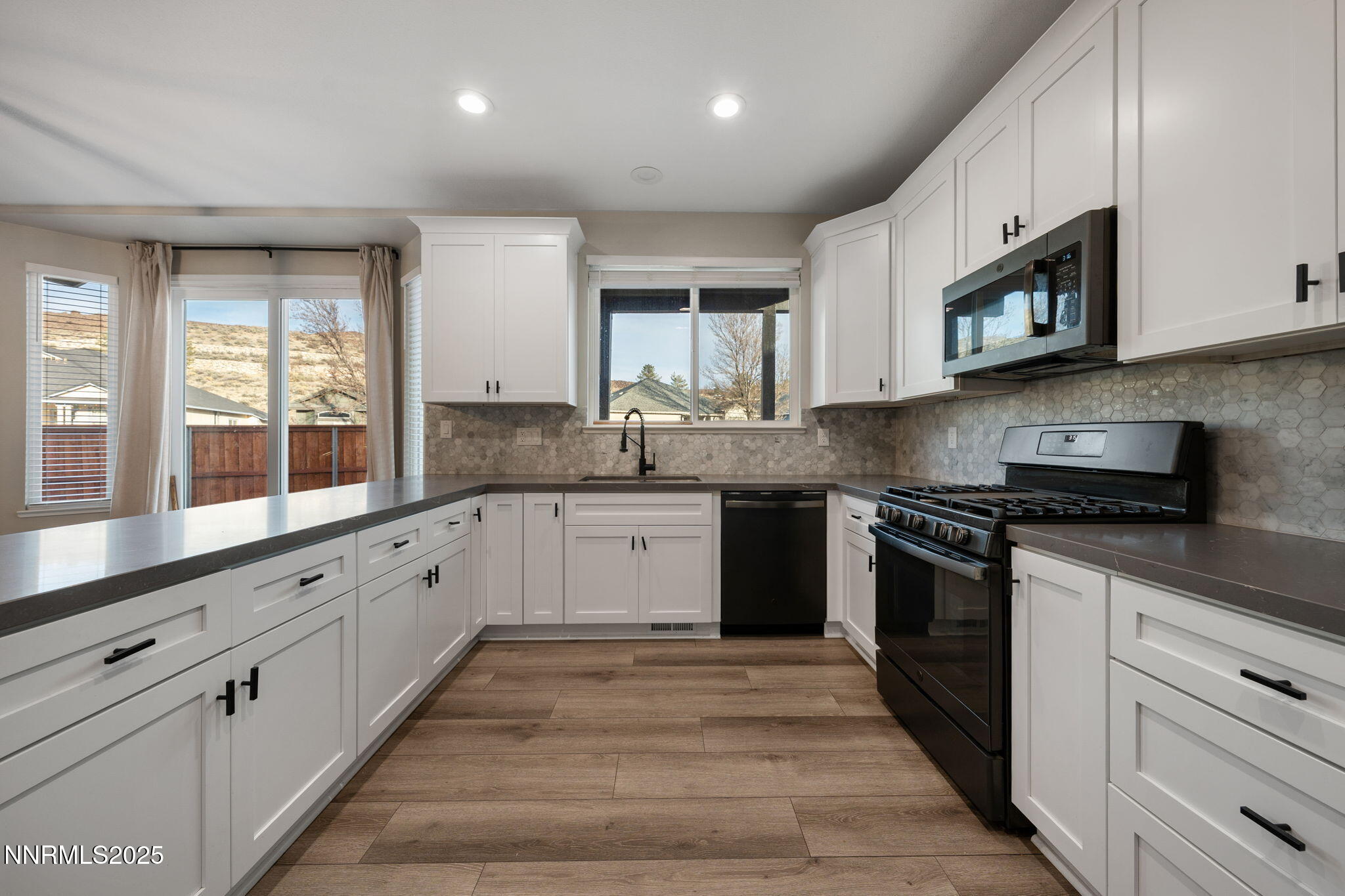 7510 Michaela Drive Reno, NV 89511 - Photo 6 of 33 a kitchen with granite countertop cabinets stainless steel appliances and a sink