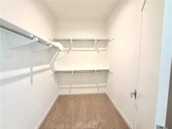 a view of an empty walk in closet