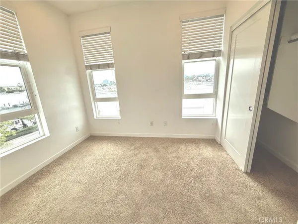 a view of an empty room and a window
