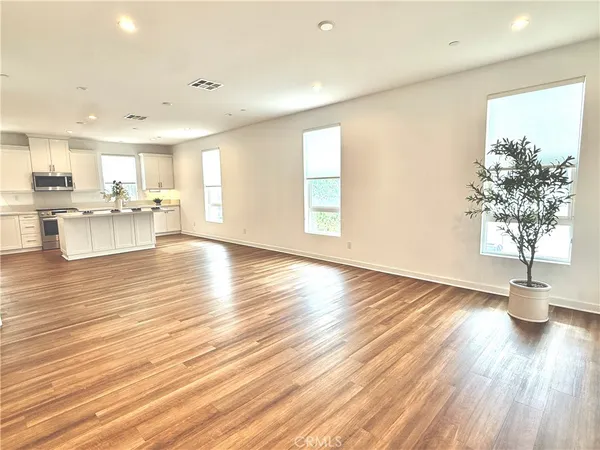 a view of dining room with furniture and wooden floor
