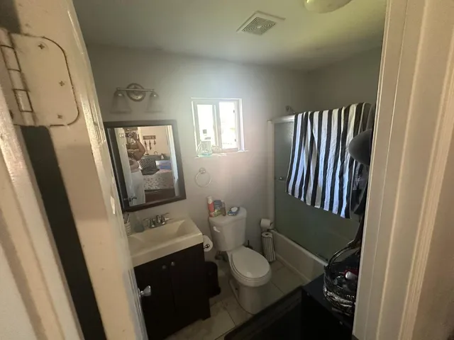 a bathroom with a sink and toilet
