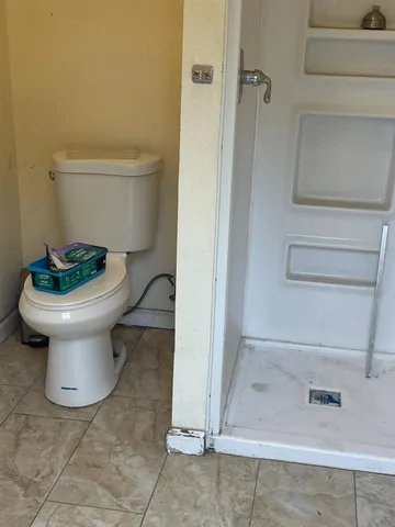 a bathroom with a toilet and a sink