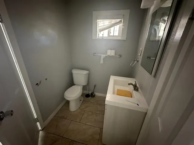 a bathroom with a toilet and a sink