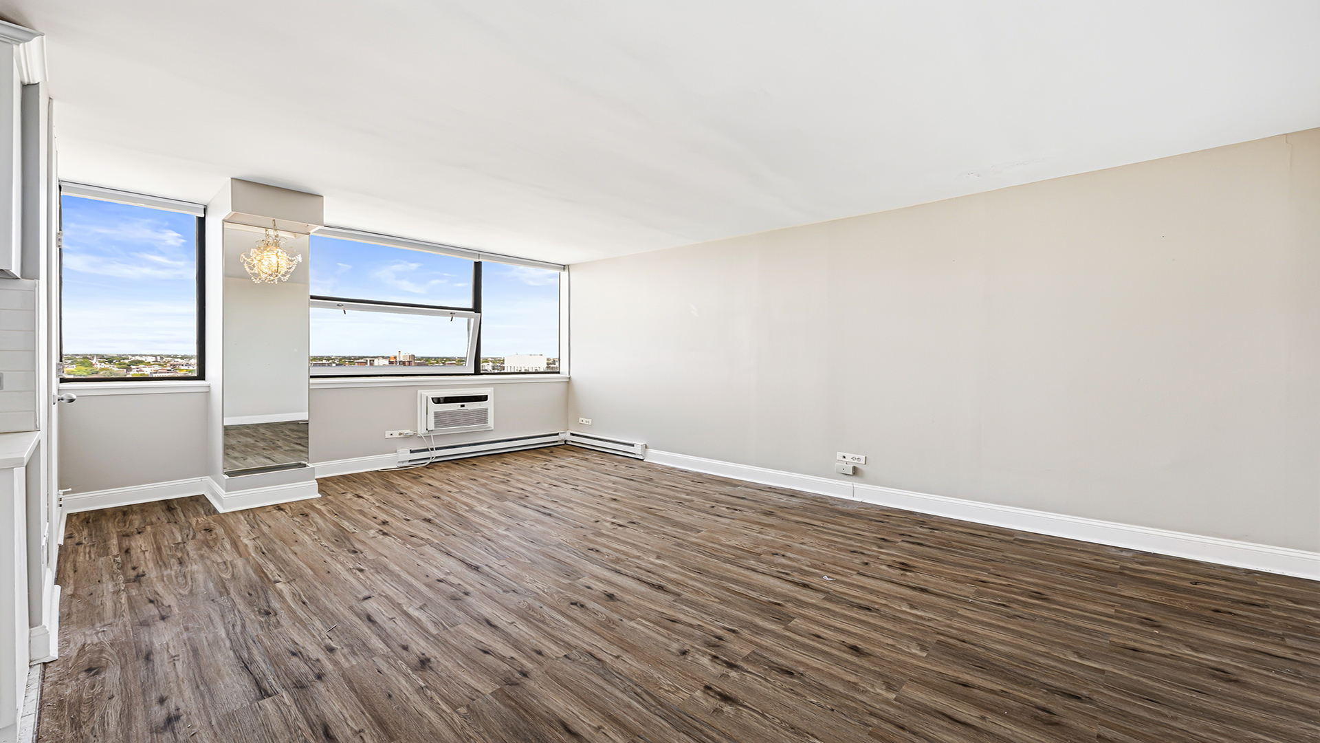 3110 North Sheridan Road, Unit 1807 Chicago, IL 60657 - Photo 6 of 21 a view of a kitchen with wooden floor and electronic appliances
