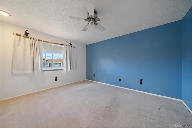 a view of empty room with a fireplace