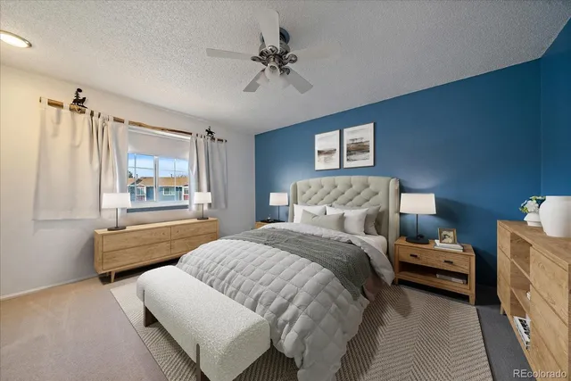 a bedroom with a bed and a couch