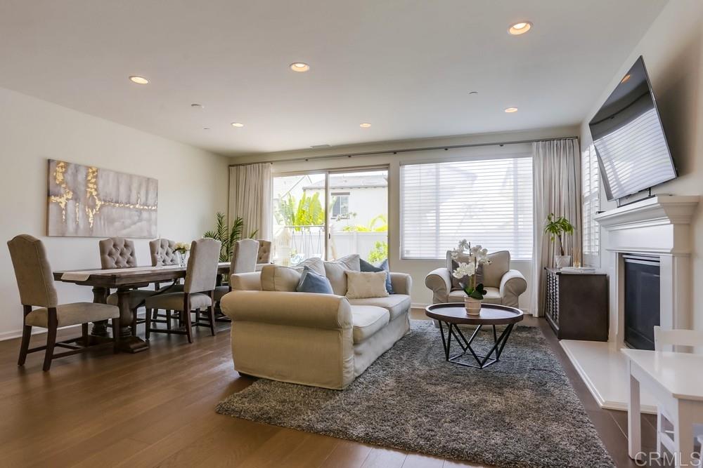 13416 Red Oak Way San Diego, CA 92130 - Photo 2 of 24 a living room with furniture a fireplace and a large window