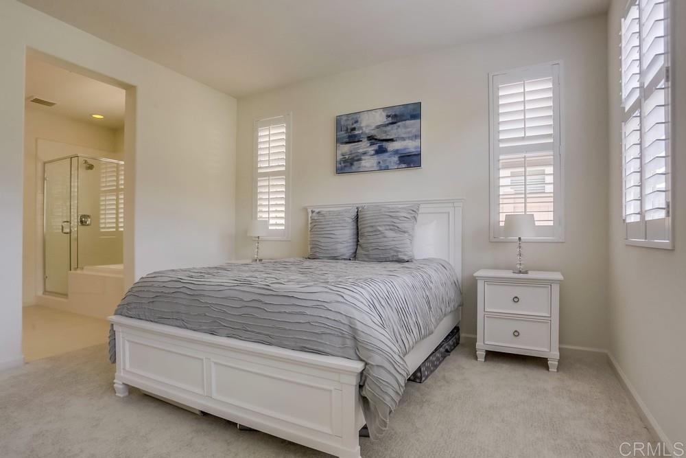 13416 Red Oak Way San Diego, CA 92130 - Photo 19 of 24 a spacious bedroom with a bed and a window