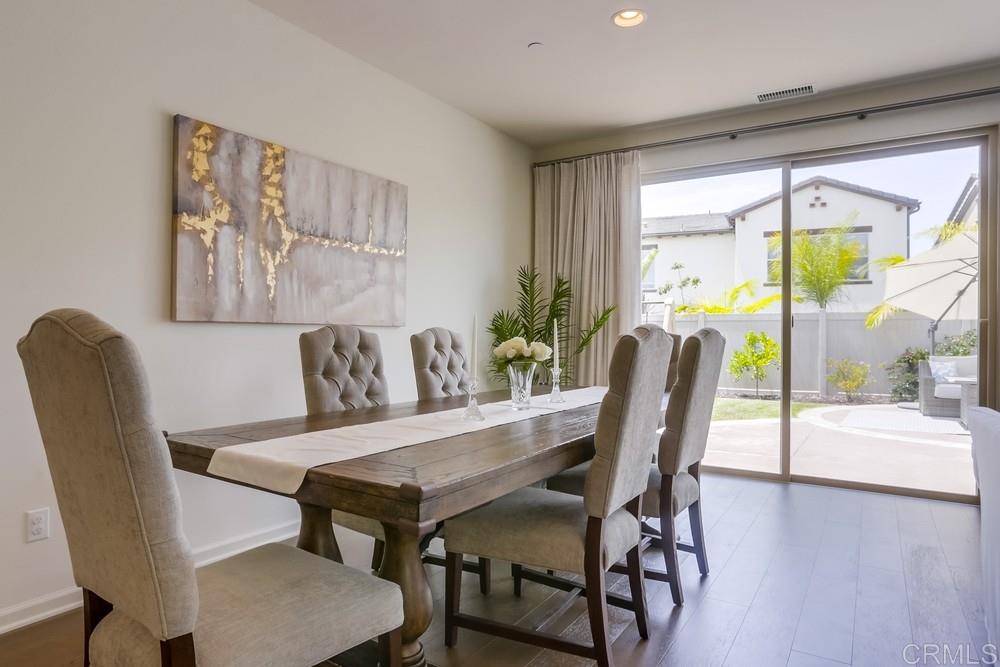 13416 Red Oak Way San Diego, CA 92130 - Photo 3 of 24 a view of a dining room with furniture and a potted plant