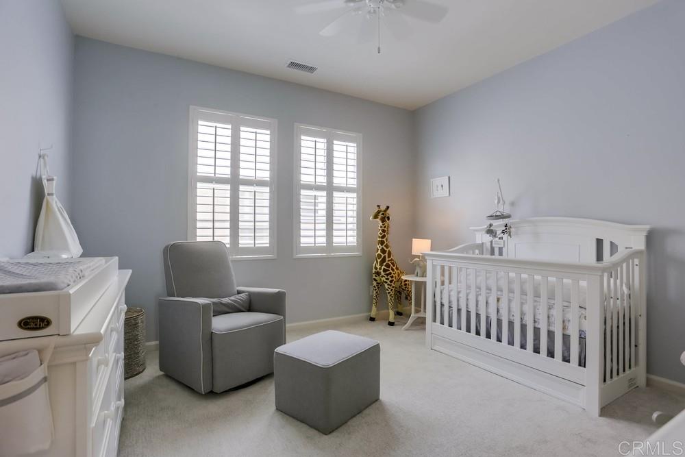 13416 Red Oak Way San Diego, CA 92130 - Photo 21 of 24 a bedroom with furniture and windows