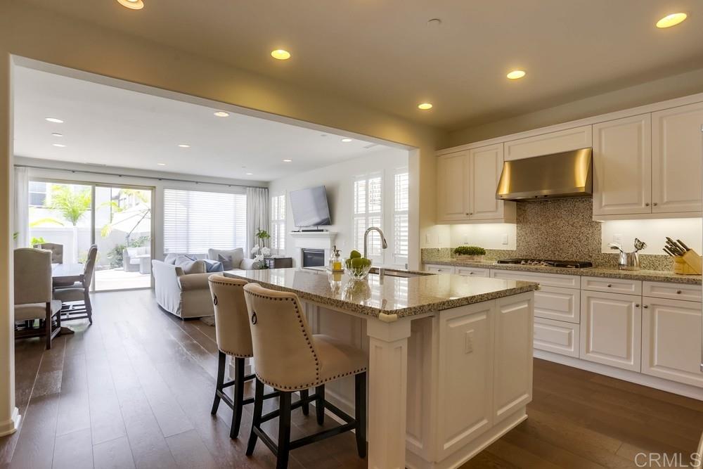 13416 Red Oak Way San Diego, CA 92130 - Photo 8 of 24 a kitchen with counter top space a sink cabinets and appliances