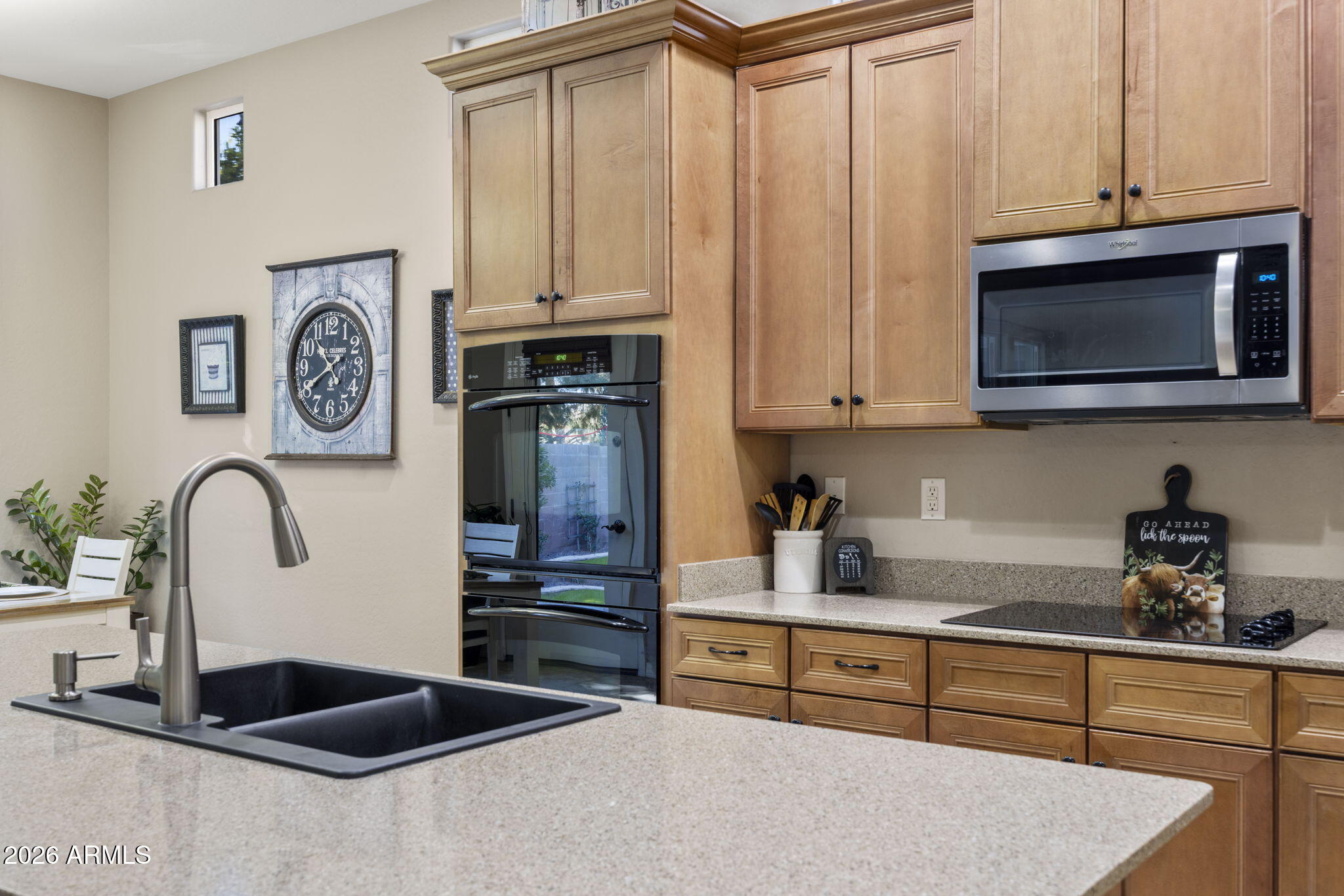 3831 East Weather Vane Road Gilbert, AZ 85296 - Photo 16 of 64 a kitchen with stainless steel appliances granite countertop a refrigerator and a stove top oven