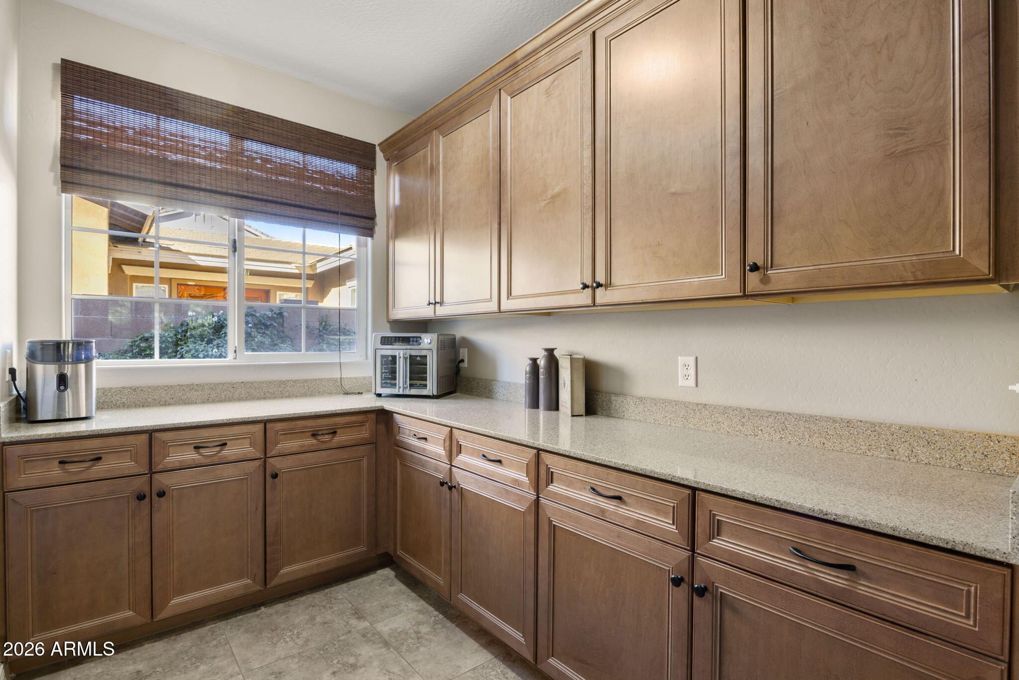 3831 East Weather Vane Road Gilbert, AZ 85296 - Photo 18 of 64 a kitchen with a sink cabinets and window
