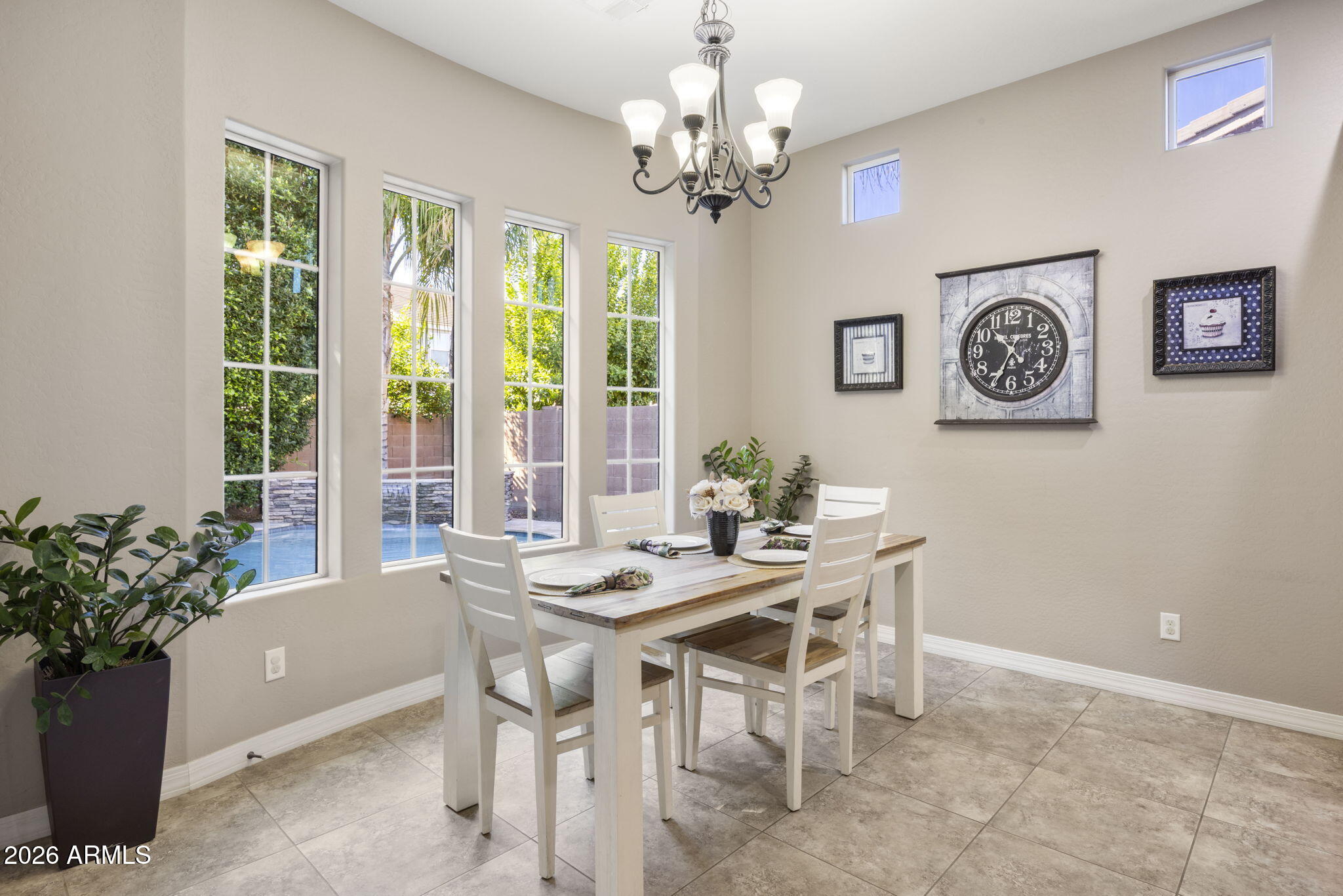 3831 East Weather Vane Road Gilbert, AZ 85296 - Photo 22 of 64 a view of a dining room with furniture and a chandelier
