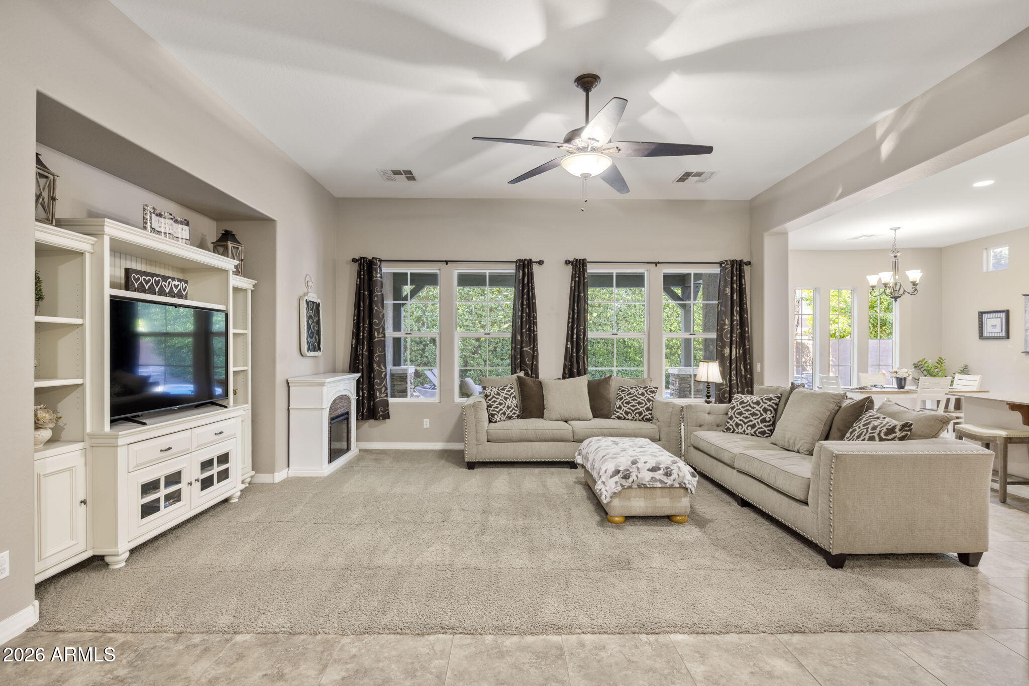 3831 East Weather Vane Road Gilbert, AZ 85296 - Photo 23 of 64 a living room with furniture and a flat screen tv