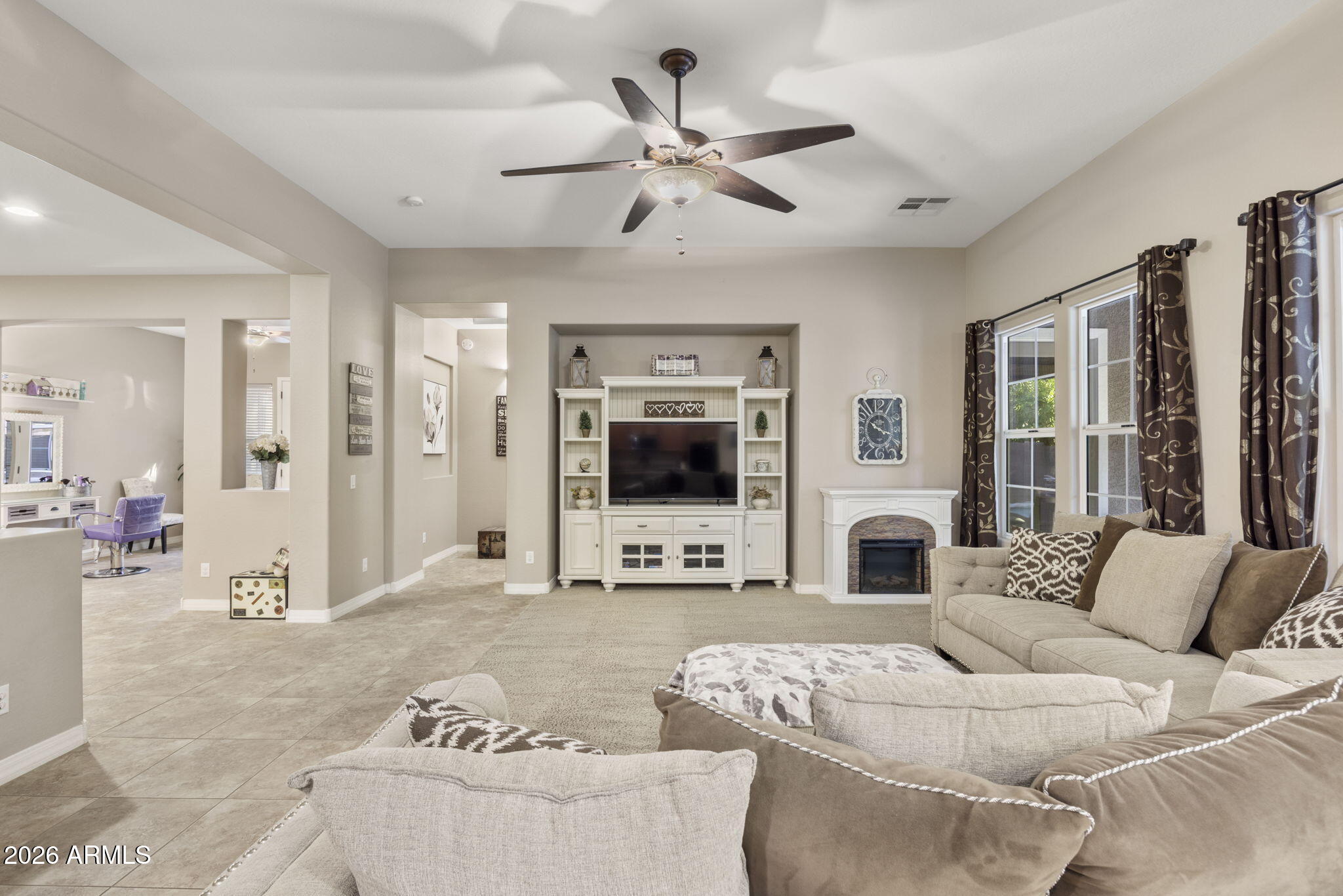 3831 East Weather Vane Road Gilbert, AZ 85296 - Photo 26 of 64 a living room with furniture and a flat screen tv