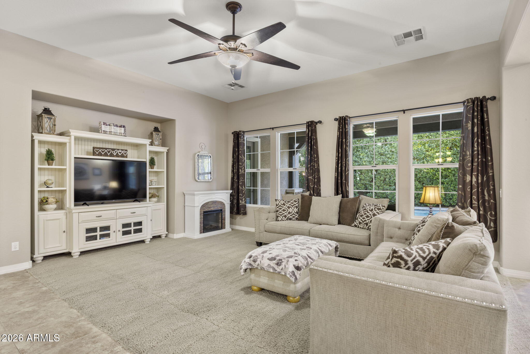 3831 East Weather Vane Road Gilbert, AZ 85296 - Photo 27 of 64 a living room with furniture and a flat screen tv