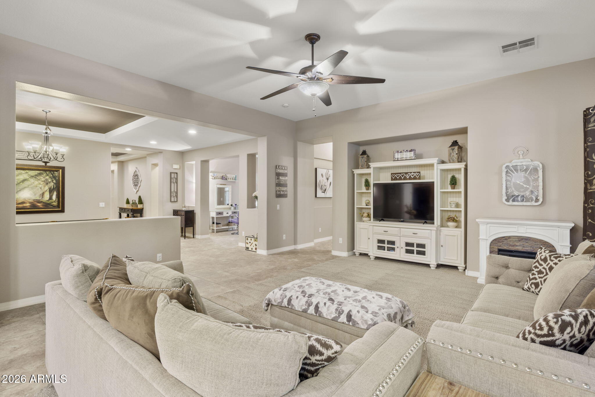 3831 East Weather Vane Road Gilbert, AZ 85296 - Photo 28 of 64 a living room with furniture and a flat screen tv