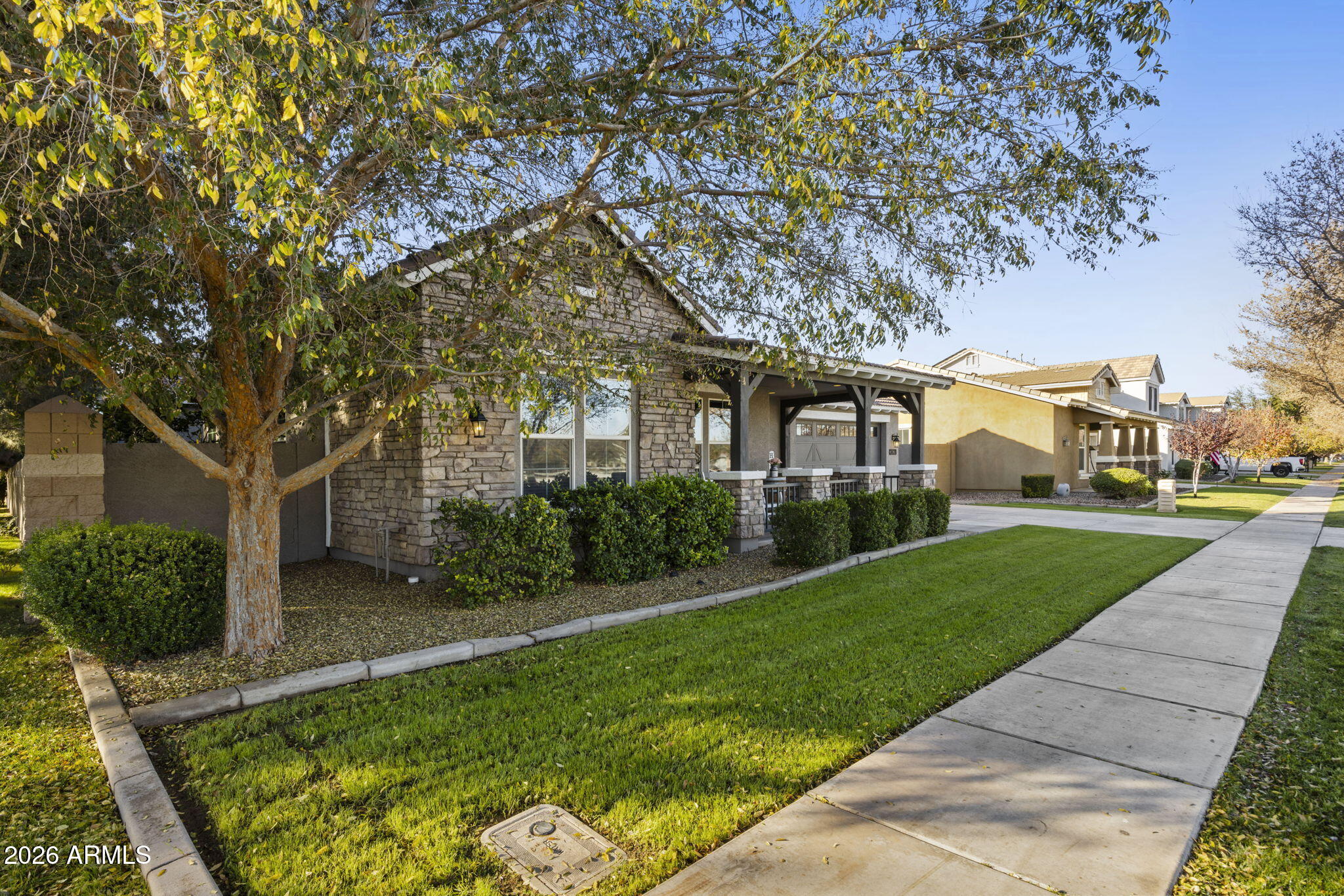 3831 East Weather Vane Road Gilbert, AZ 85296 - Photo 3 of 64 a front view of a house with a yard