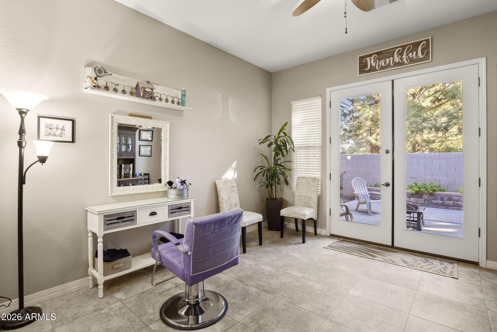 3831 East Weather Vane Road Gilbert, AZ 85296 - Photo 31 of 64 a view of a livingroom with furniture a flat screen tv and windows