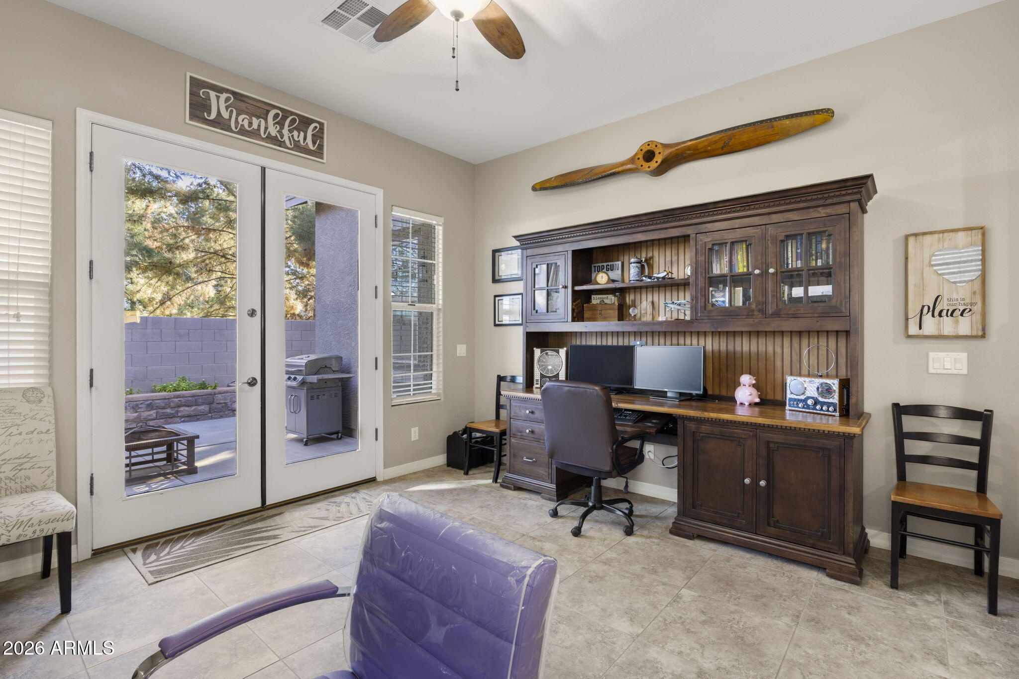3831 East Weather Vane Road Gilbert, AZ 85296 - Photo 32 of 64 a view of a workspace with furniture and a window