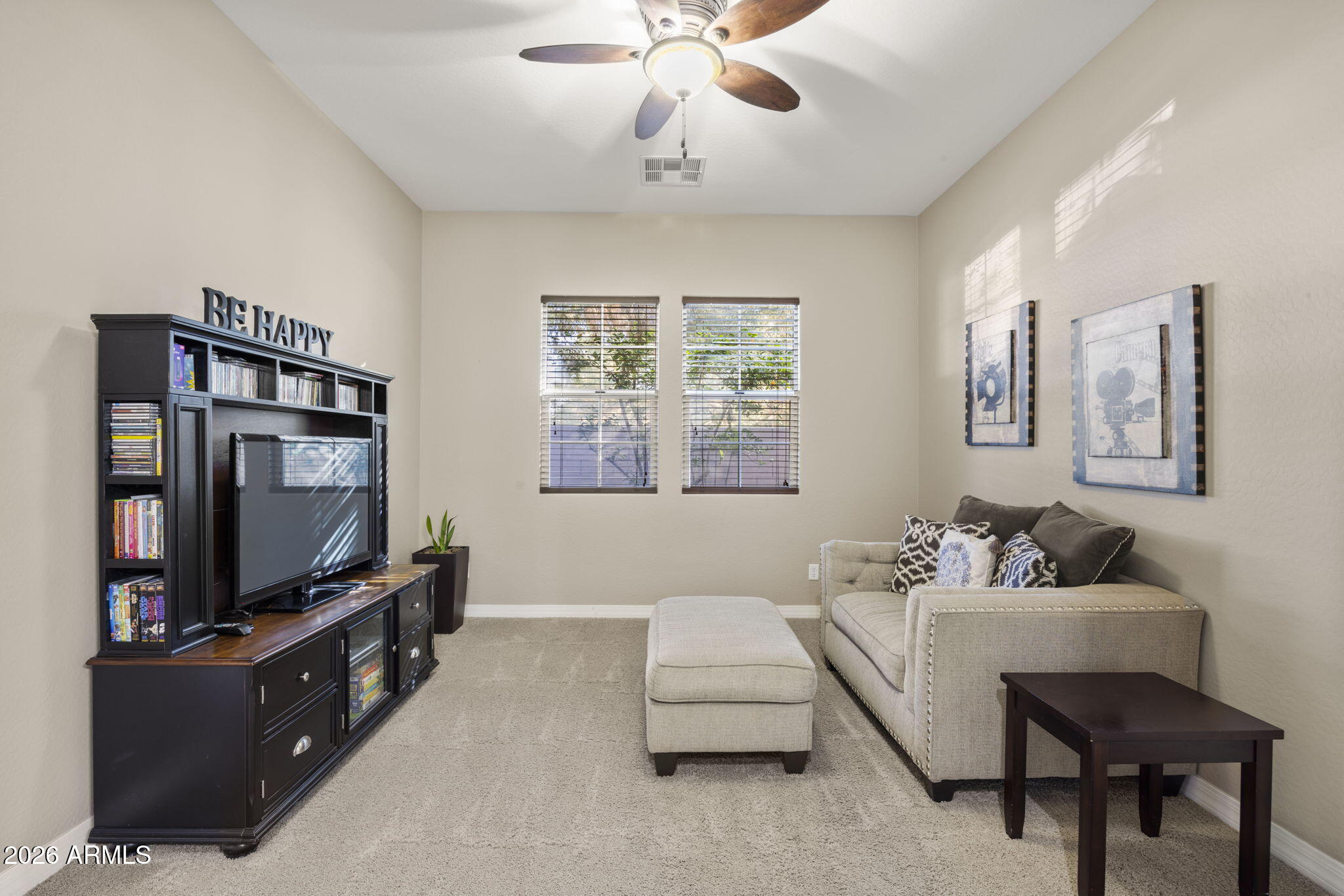 3831 East Weather Vane Road Gilbert, AZ 85296 - Photo 33 of 64 a living room with furniture and a flat screen tv