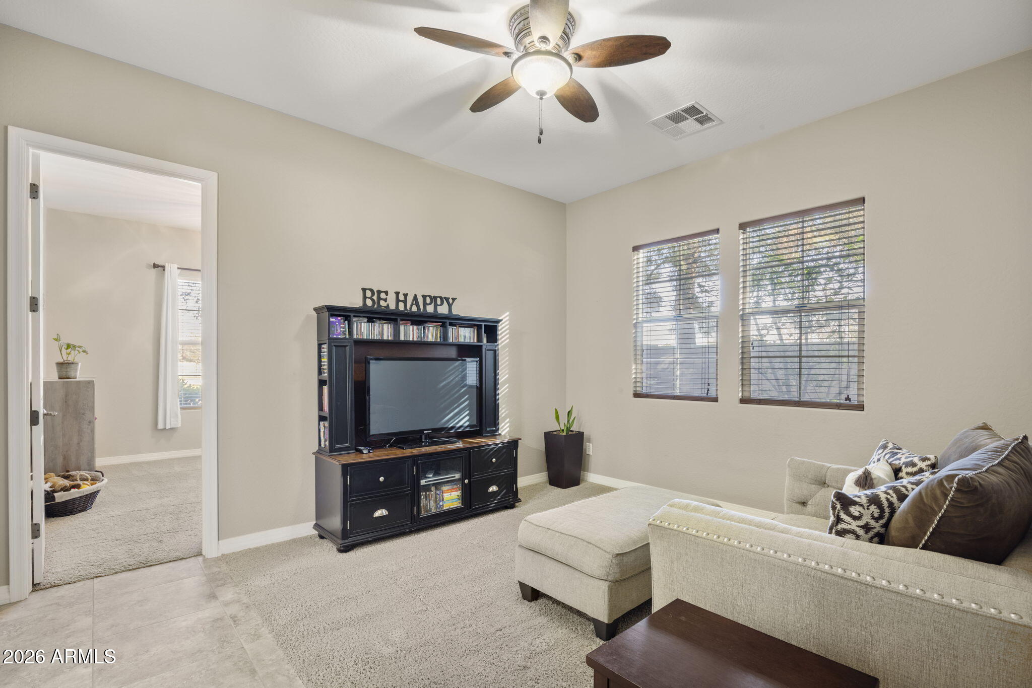3831 East Weather Vane Road Gilbert, AZ 85296 - Photo 34 of 64 a living room with furniture and a flat screen tv