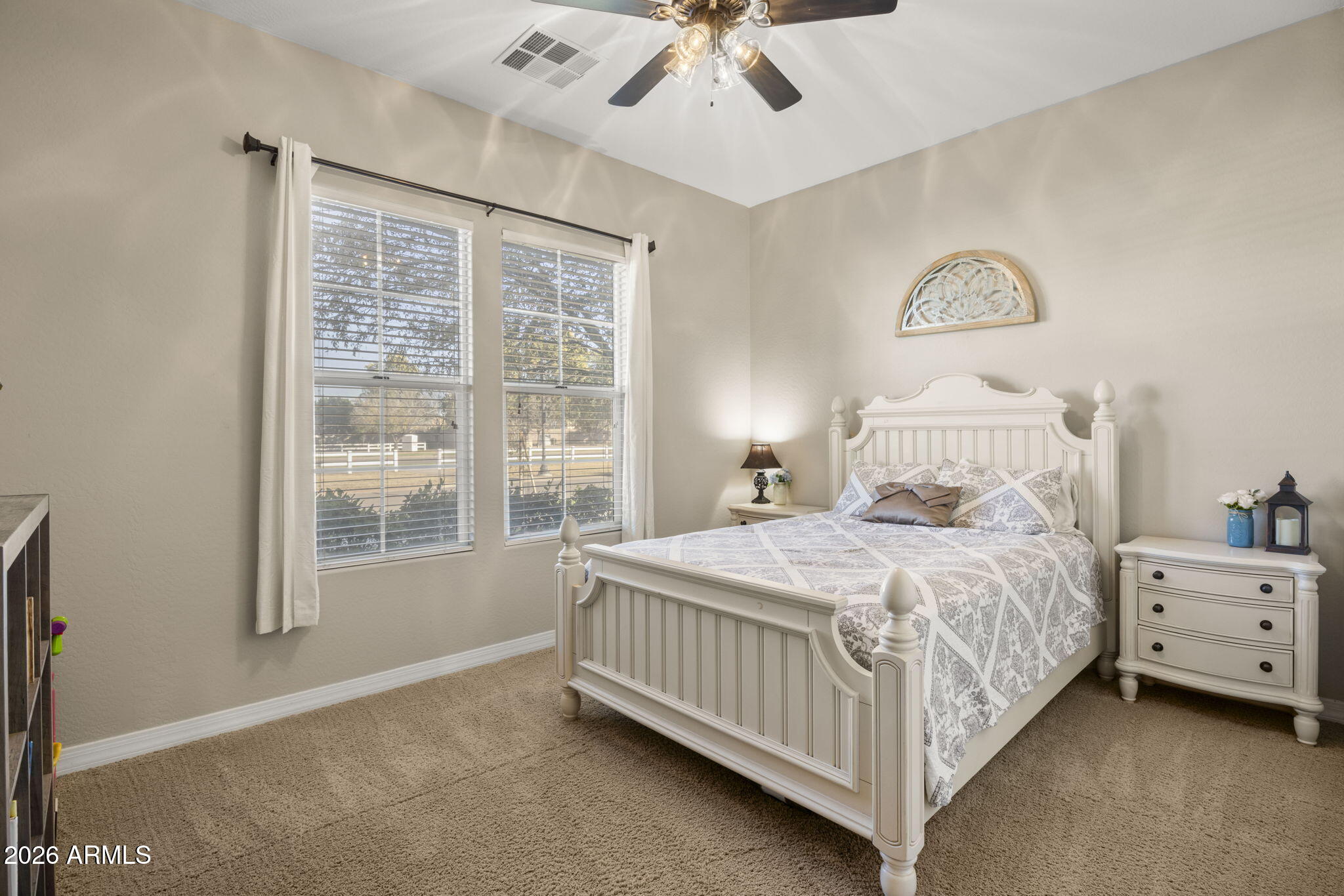 3831 East Weather Vane Road Gilbert, AZ 85296 - Photo 36 of 64 a bedroom with a bed chandelier and a window