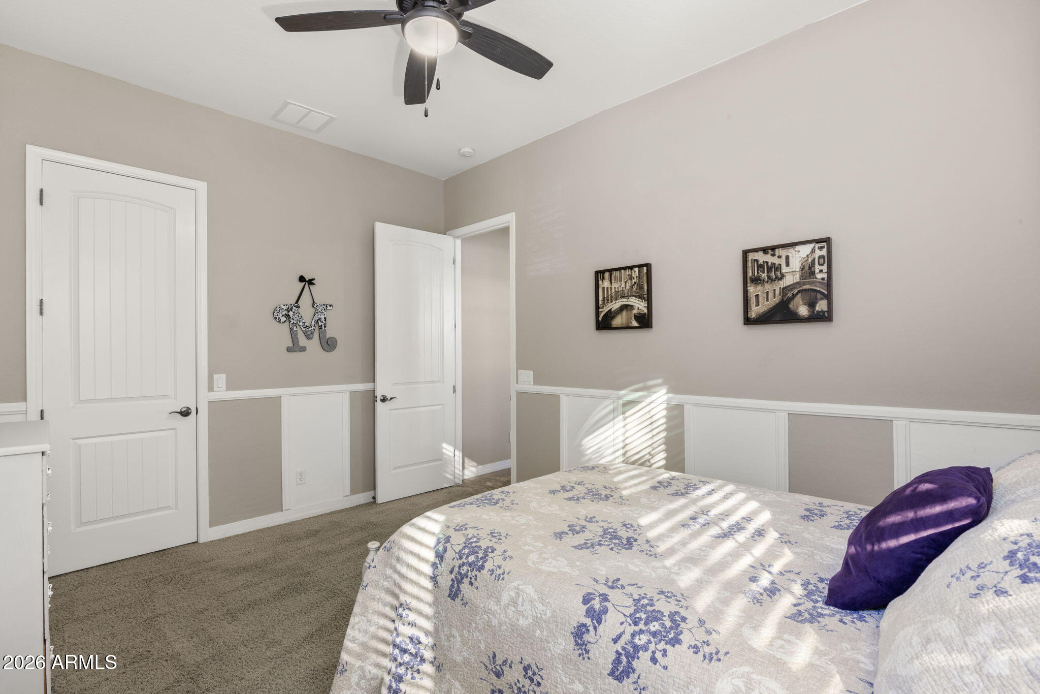 3831 East Weather Vane Road Gilbert, AZ 85296 - Photo 40 of 64 a bedroom with a large bed and a chandelier