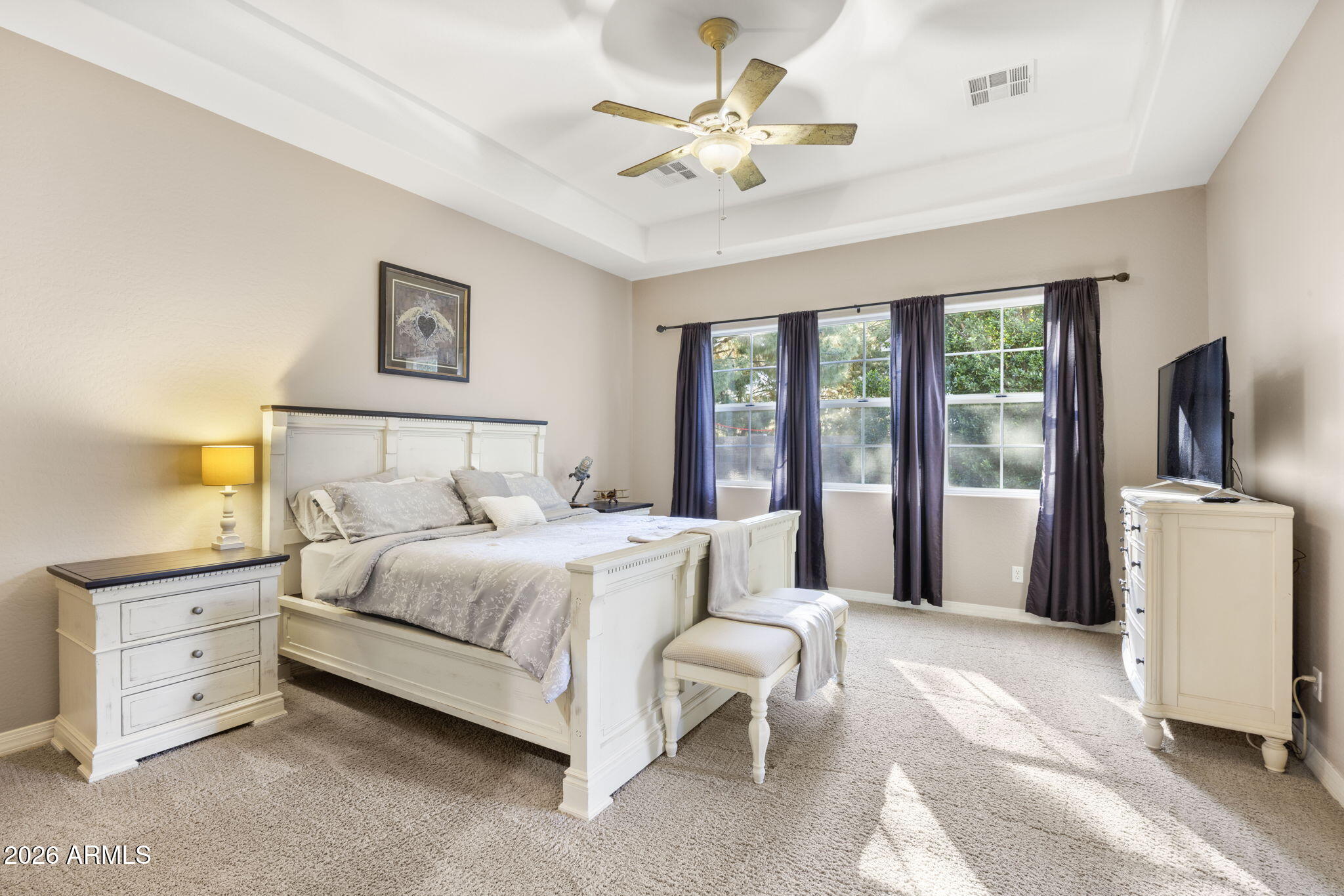 3831 East Weather Vane Road Gilbert, AZ 85296 - Photo 41 of 64 a bedroom with a large bed and a chandelier