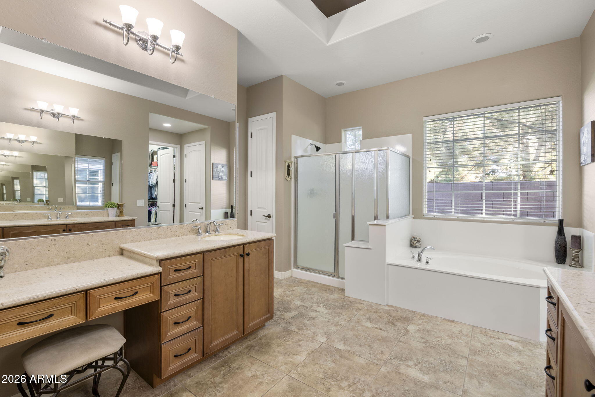 3831 East Weather Vane Road Gilbert, AZ 85296 - Photo 44 of 64 a spacious bathroom with a granite countertop tub sink shower and mirror