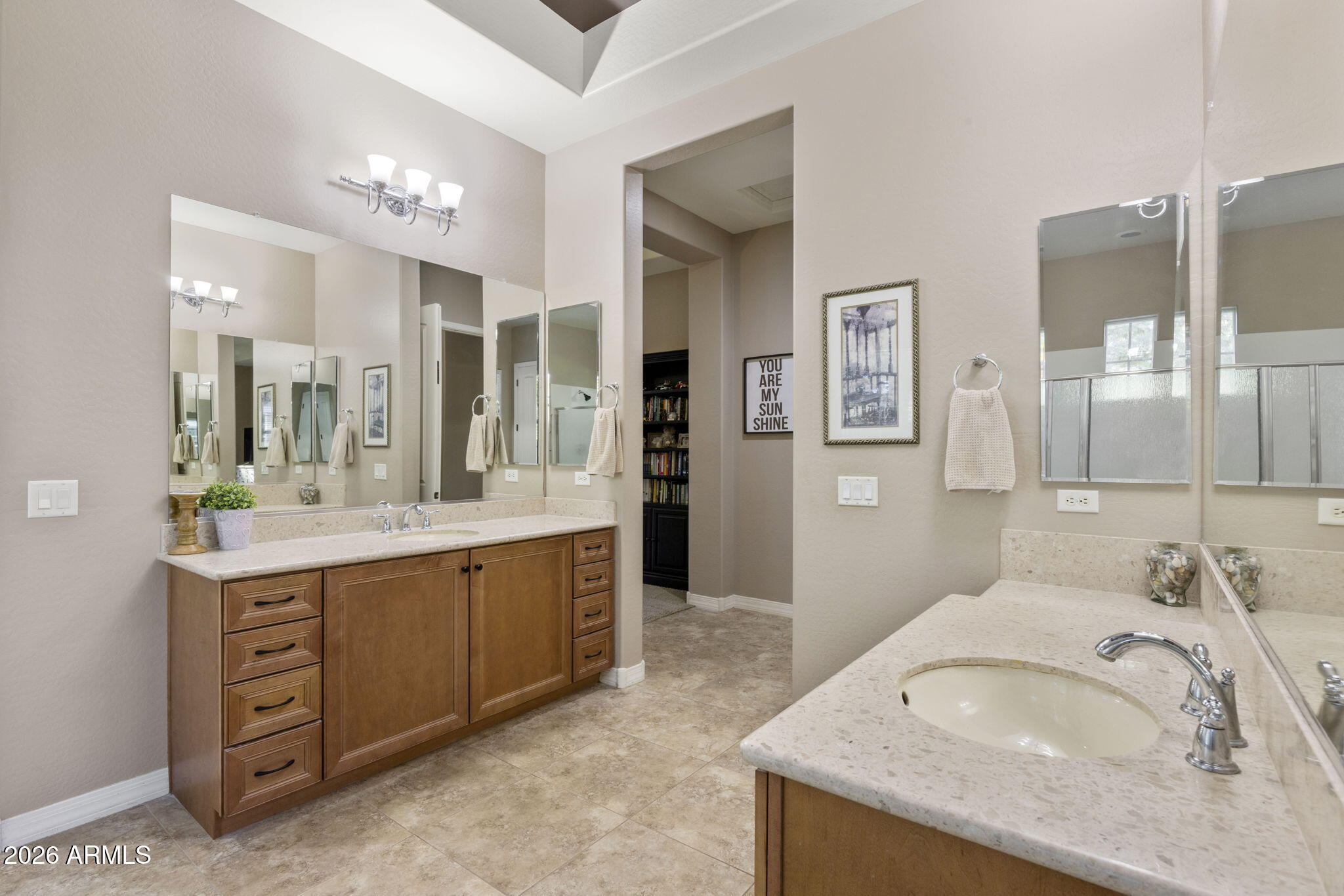 3831 East Weather Vane Road Gilbert, AZ 85296 - Photo 45 of 64 a spacious bathroom with a granite countertop double vanity sink mirror and shower