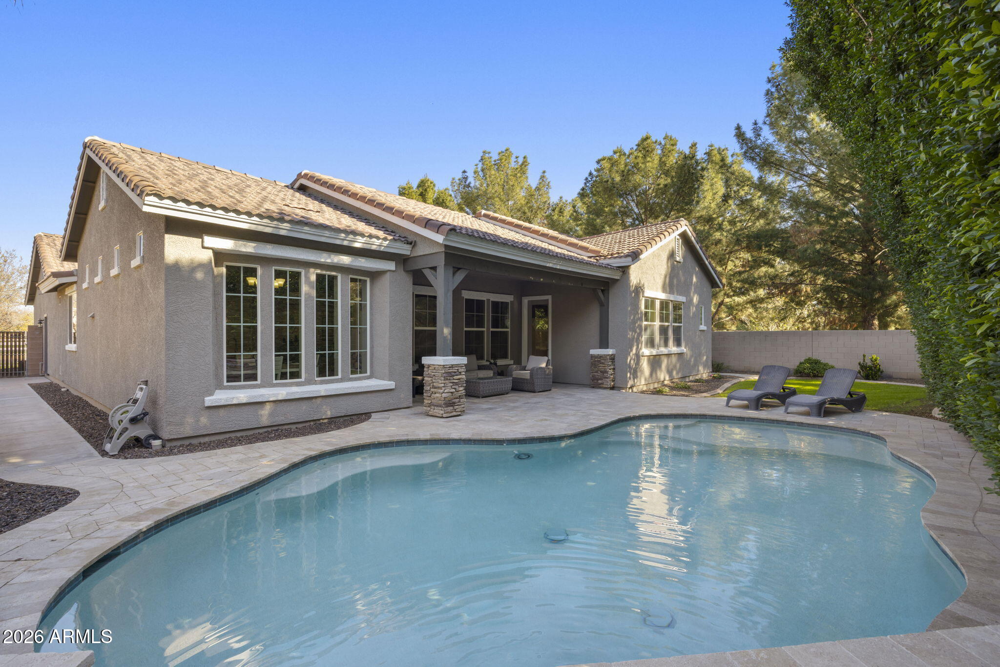 3831 East Weather Vane Road Gilbert, AZ 85296 - Photo 48 of 64 a view of a house with swimming pool and sitting area